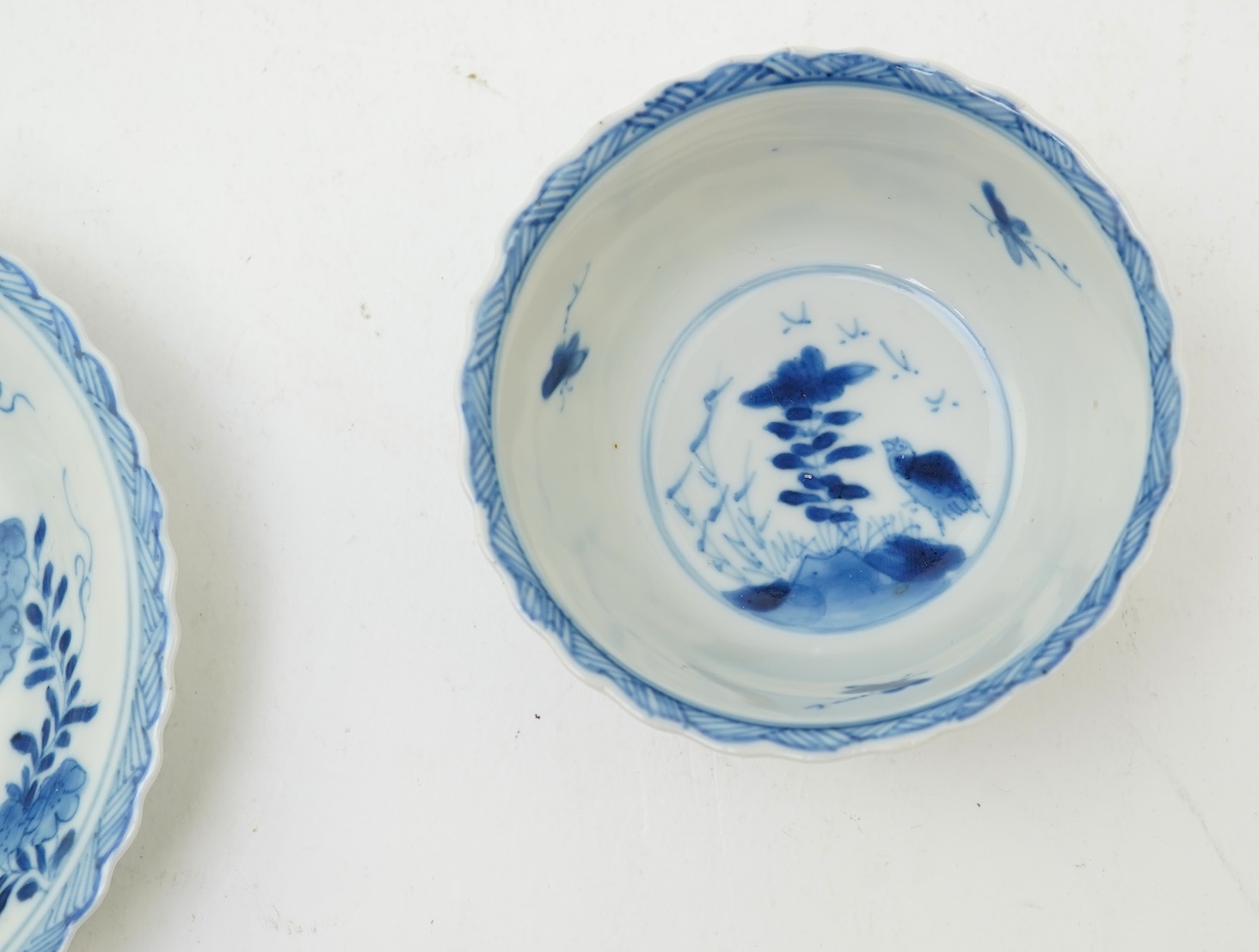 A Chinese blue and white tea bowl and saucer, Kangxi period